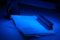 Checking the passport for fraud in UV and another light, detection of luminescence of protective components of the document (