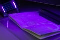 Checking the passport for fraud in UV light, detection of luminescence of protective components of the document threads, melange
