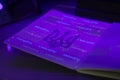 Checking the passport for fraud in UV light, detection of luminescence of protective components of the document threads, melange