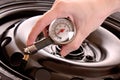 Checking pressure in tyre Royalty Free Stock Photo