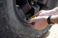 Checking pressure of tyre Royalty Free Stock Photo