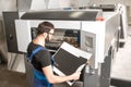 Checking printing quality at the printing plant Royalty Free Stock Photo