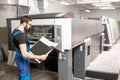 Checking printing quality at the printing plant Royalty Free Stock Photo