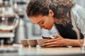 Checking quality. Close up view portrait of a beautiful young woman professional Q Grader test and inspecting the quality of