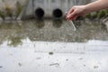 Checking the quality of water in wastewater. Test tube with a sample in hand. Sewage treatment