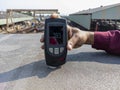 Checking surface profile of steel top flange after steel grit blasting with digital surface profile gauge