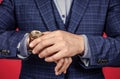 Checking time on portable timepiece worn on male hand formal fashion style, watch