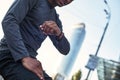 Checking time. Sporty african man in sportswear is checking time on his watch and ready to continue his workout outside Royalty Free Stock Photo