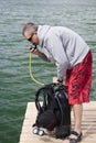 Checking up scuba gear Royalty Free Stock Photo