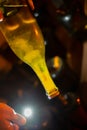 Checking of yeast in bottles, Champagne sparkling wine production in bottles in racks in underground cellar, Reims, Champagne,