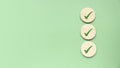 Checklist concept. Accomplishment of objectives or goals. To do list. Planning and verification. Checkmark over a green background