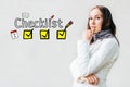 Checklist concept - girl on a white background with icons and text Royalty Free Stock Photo