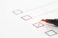 Checklist concept - Red pen check mark on paper checklist box for questionnaire form Royalty Free Stock Photo