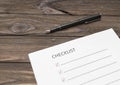 A checklist on a sheet of paper, a pen Royalty Free Stock Photo