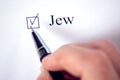 Checklist with a word Jew on white paper. Checkbox and religion concept