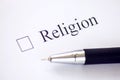 Checklist with a word Religion on white paper with pen. Checkbox concept