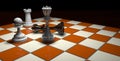 Checkmate the fallen black king with the queen, a pawn and a white tower on a brown and white chess board on a dark brown surface