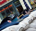 Checkpoint Charlie with Soviet military caps on sandbags. Berlin, Germany