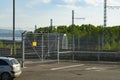 Checkpoint fenced with a fence with barbed wire on top of the hydroelectric power station. Royalty Free Stock Photo