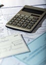 Tax Documents with Calculator and Cheque