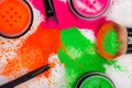 Cheek brush with neon cosmetic powder colorful pile on white background Royalty Free Stock Photo