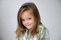 Cheekily schoolgirl with long hair and freckles Royalty Free Stock Photo