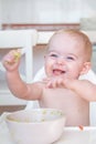 cheeky baby playing with food Royalty Free Stock Photo