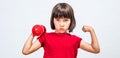 Cheeky child pouting, raising hands with dumbbell and strong fist Royalty Free Stock Photo