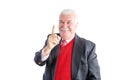 Cheeky senior wearing a business suit smiles Royalty Free Stock Photo