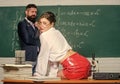 Cheeky teacher. Impudent student. Flirting colleague. Girl sexy buttocks sit table. Everyone dreaming about such teacher