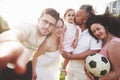 Cheerful active family having fun at countryside in summer day. Royalty Free Stock Photo