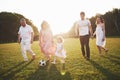 Cheerful active family having fun at countryside in summer day. Royalty Free Stock Photo