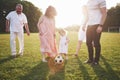 Cheerful active family having fun at countryside in summer day. Royalty Free Stock Photo