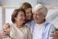 Cheerful adult daughter having fun with elder mom and dad Royalty Free Stock Photo