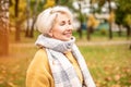 Cheerful adult woman on a relaxing walk at park