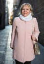 Cheerful adult woman in scarf