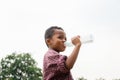 Cheerful african american boy drinking water after playing at park Royalty Free Stock Photo