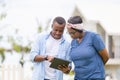 Cheerful african american couple with digital tablet, happiness family concepts Royalty Free Stock Photo