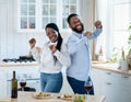 Cheerful African American Couple Having Fun At Home, Dancing Together In Kitchen Royalty Free Stock Photo