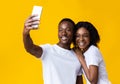 Cheerful african american couple taking selfie on mobile phone Royalty Free Stock Photo