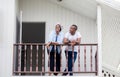 Cheerful african american couple at wooden balcony, happiness family concepts