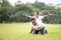 Cheerful african american father giving son piggyback ride outdoors smiling, Happiness family concepts Royalty Free Stock Photo