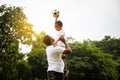 Cheerful african american father and son playing with football in park, Happiness family concepts Royalty Free Stock Photo