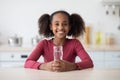 Cheerful african american girl teenager drinking water Royalty Free Stock Photo