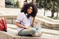 Cheerful African American Student Girl Using Laptop Sitting Outdoors Royalty Free Stock Photo