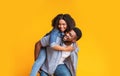 Cheerful African Couple Having Fun Together, Guy Piggybacking His Girlfriend Royalty Free Stock Photo