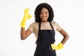 Cheerful african housekeeper female showing ok sign as great cleaning services concept on white background