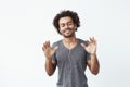 Cheerful african man listening to music in headphones dancing singing. Royalty Free Stock Photo