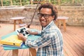 Cheerful african young man using tablet in outdoor cafe Royalty Free Stock Photo