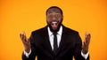 Cheerful afro-american man in businesswear happy with lucrative proposition sale